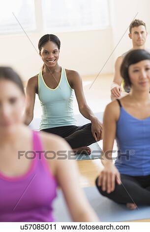People training yoga in gym View Large Photo Image Stock Image - People training yoga in gym. Fotosearch