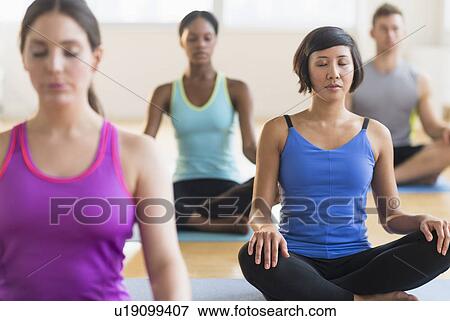People training yoga in gym View Large Photo Image Stock Photo - People training yoga in gym. Fotosearch