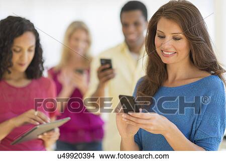 People using communication devices View Large Photo Image Picture - People using communication devices. Fotosearch