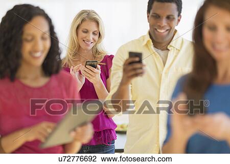 People using communication devices View Large Photo Image Stock Image - People using communication devices. Fotosearch