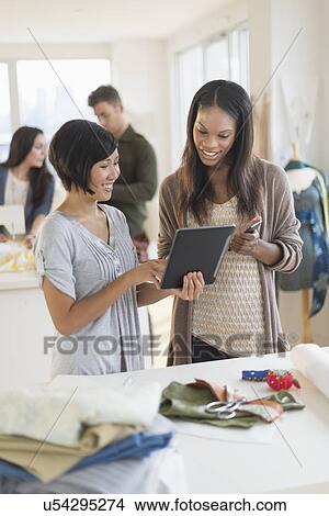 Picture - People working in fashion studio. Fotosearch