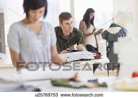 People working in fashion studio View Large Photo Image Stock Image - People working in fashion studio. Fotosearch