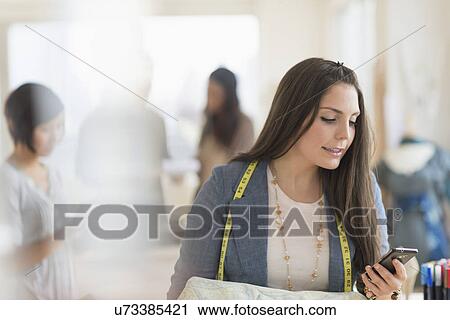 People working in fashion studio View Large Photo Image Stock Image - People working in fashion studio. Fotosearch