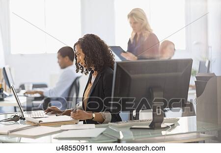 Stock Image - People working in office. Fotosearch