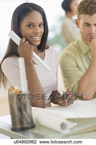 Stock Image - People working in office. Fotosearch
