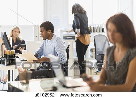 People working in office View Large Photo Image Stock Image - People working in office. Fotosearch