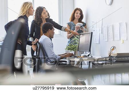 Stock Photo - People working in office. Fotosearch