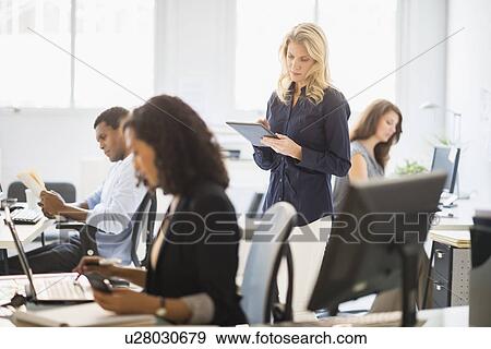 People working in office View Large Photo Image Stock Photo - People working in office. Fotosearch