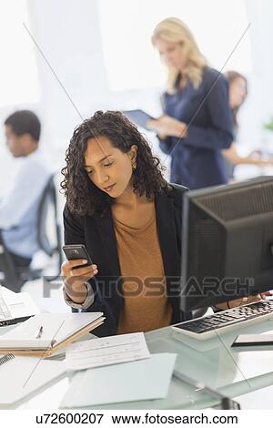 Stock Photo - People working in office. Fotosearch