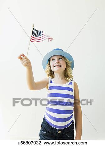 Portrait of blonde girl (4-5) holding American flag View Large Photo Image Stock Image - Portrait of blonde girl (4-5) holding American flag. Fotosearch