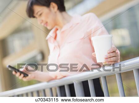 Portrait of business woman text messaging View Large Photo Image Stock Photography - Portrait of business woman text messaging. Fotosearch