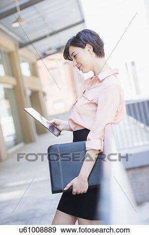 Portrait of business woman using digital tablet View Large Photo Image Stock Photo - Portrait of business woman using digital tablet. Fotosearch