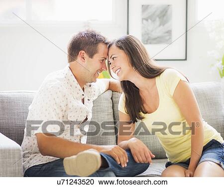 Portrait of couple on sofa, face to face View Large Photo Image Stock Image - Portrait of couple on sofa, face to face. Fotosearch