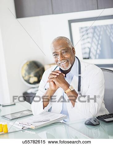 Portrait of doctor in office View Large Photo Image Stock Photography - Portrait of doctor in office. Fotosearch