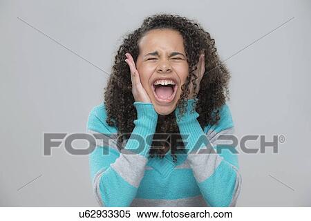 Portrait of girl (12-13) screaming View Large Photo Image Stock Photography - Portrait of girl (12-13) screaming. Fotosearch