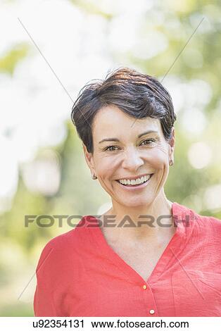 Portrait of happy mature woman smiling View Large Photo Image Stock Image - Portrait of happy mature woman smiling. Fotosearch