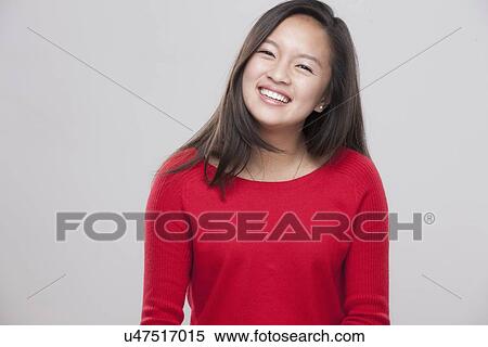 Stock Photography - Portrait of happy teenage girl (16-17) . Fotosearch