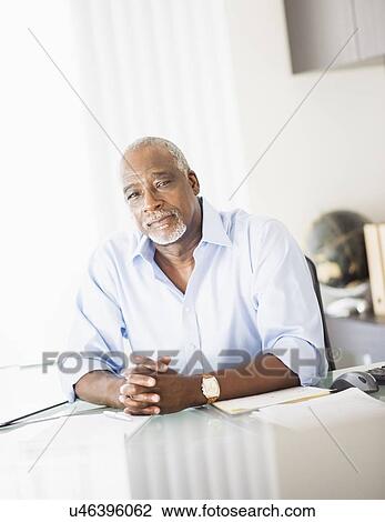 Stock Image - Portrait of man in office. Fotosearch