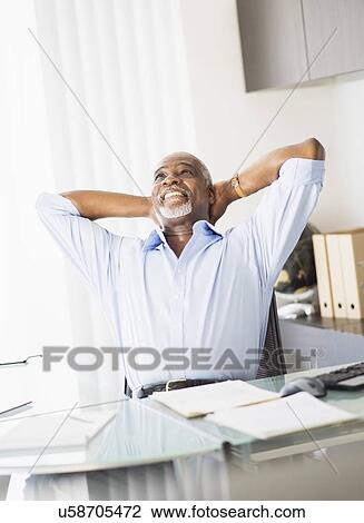 Stock Image - Portrait of man in office. Fotosearch