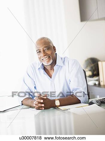 Portrait of man in office View Large Photo Image Stock Photo - Portrait of man in office. Fotosearch