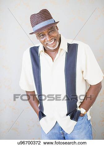 Portrait of man wearing straw hat View Large Photo Image Stock Image - Portrait of man wearing straw hat. Fotosearch