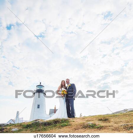 Portrait of married couple, lighthouse in background View Large Photo Image Picture - Portrait of married couple, lighthouse in background. Fotosearch