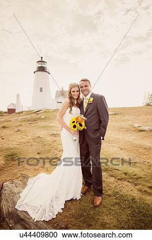 Portrait of married couple, lighthouse in background View Large Photo Image Stock Image - Portrait of married couple, lighthouse in background. Fotosearch