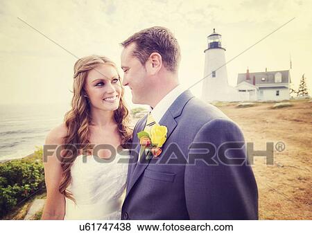 Portrait of married couple, lighthouse in background View Large Photo Image Stock Photo - Portrait of married couple, lighthouse in background. Fotosearch