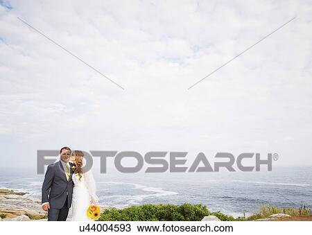 Portrait of married couple, woman kissing man View Large Photo Image Stock Image - Portrait of married couple, woman kissing man. Fotosearch