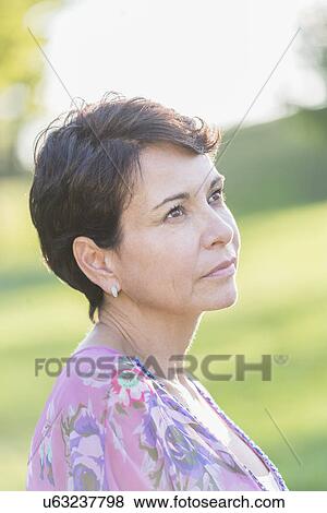 Portrait of mature woman outdoors View Large Photo Image Stock Photo - Portrait of mature woman outdoors. Fotosearch