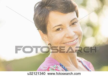 Portrait of mature woman smiling View Large Photo Image Stock Image - Portrait of mature woman smiling . Fotosearch