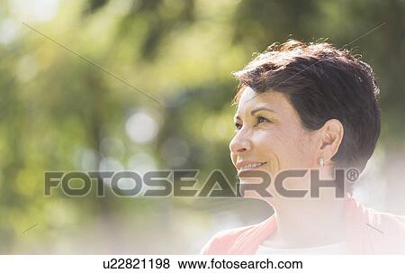 Stock Photo - Portrait of mature woman smiling . Fotosearch