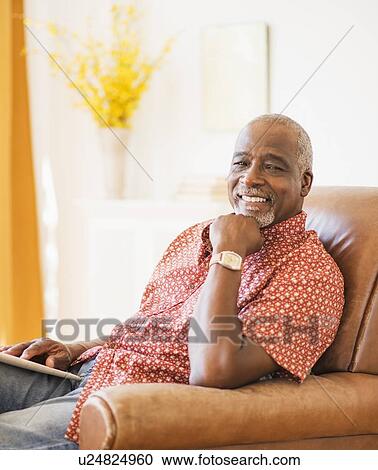 Portrait of men sitting in armchair View Large Photo Image Stock Image - Portrait of men sitting in armchair. Fotosearch