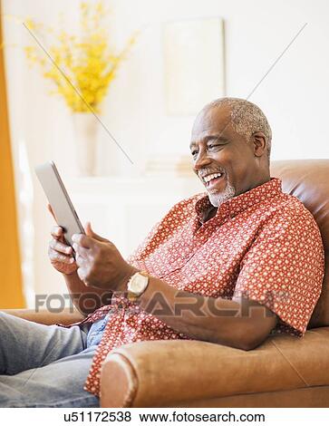 Portrait of men using digital tablet View Large Photo Image Stock Photo - Portrait of men using digital tablet . Fotosearch