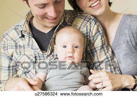 Portrait of parents with baby son (2-5 months) View Large Photo Image Picture - Portrait of parents with baby son (2-5 months). Fotosearch