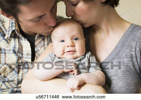 Portrait of parents with baby son (2-5 months) View Large Photo Image Stock Photograph - Portrait of parents with baby son (2-5 months). Fotosearch