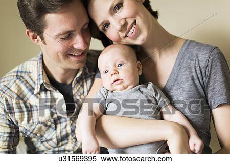 Portrait of parents with baby son (2-5 months) View Large Photo Image Stock Photography - Portrait of parents with baby son (2-5 months). Fotosearch