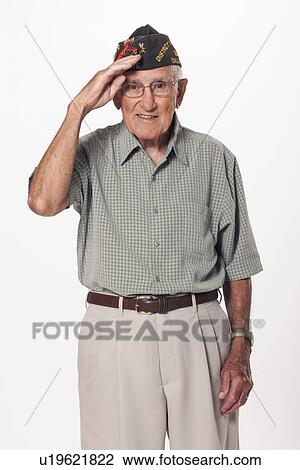 Portrait of senior man standing and saluting at camera View Large Photo Image Stock Image - Portrait of senior man standing and saluting at camera. Fotosearch