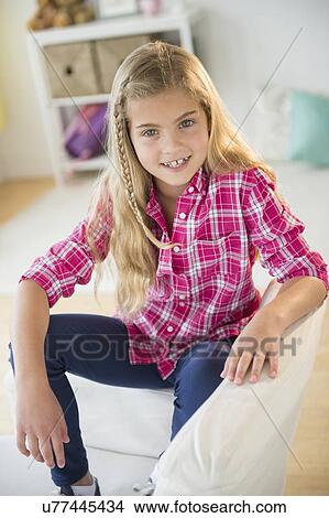 Picture - Portrait of smiling blonde girl (8-9). Fotosearch