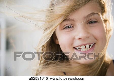 Portrait of smiling blonde girl (8-9) View Large Photo Image Stock Photography - Portrait of smiling blonde girl (8-9). Fotosearch