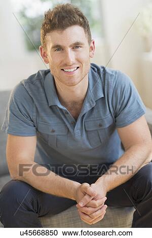Portrait of smiling young man View Large Photo Image Stock Image - Portrait of smiling young man. Fotosearch