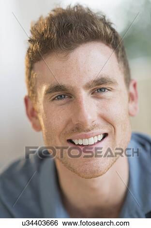 Portrait of smiling young man View Large Photo Image Stock Photograph - Portrait of smiling young man. Fotosearch