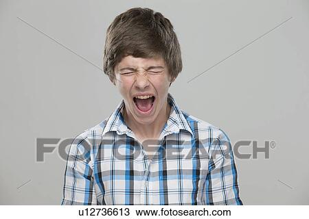 Portrait of teenage boy (14-15) shouting View Large Photo Image Stock Image - Portrait of teenage boy (14-15) shouting. Fotosearch