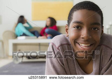Stock Image - Portrait of teenage boy (14-15). Fotosearch