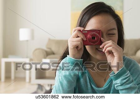 Portrait of teenage girl (16-17) with digital camera View Large Photo Image Stock Image - Portrait of teenage girl (16-17) with digital camera. Fotosearch