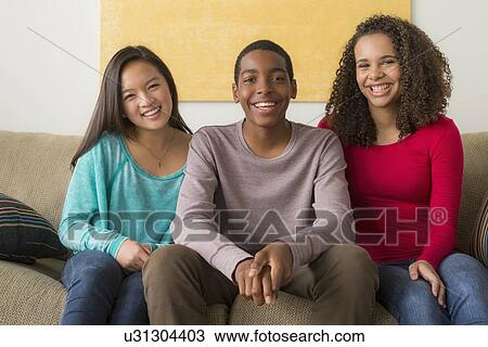 Stock Image - Portrait of three friends (12-13, 14-15, 16-17). Fotosearch