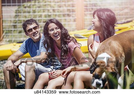 Portrait of three young people laughing View Large Photo Image Stock Photo - Portrait of three young people laughing. Fotosearch