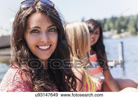 Portrait of three young women outdoors View Large Photo Image Stock Photo - Portrait of three young women outdoors. Fotosearch
