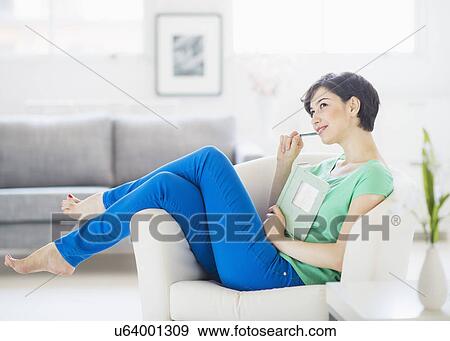 Portrait of woman holding note pad and pencil View Large Photo Image Stock Photo - Portrait of woman holding note pad and pencil. Fotosearch