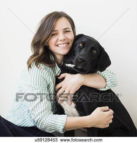 Portrait of woman with black dog View Large Photo Image Stock Image - Portrait of woman with black dog. Fotosearch